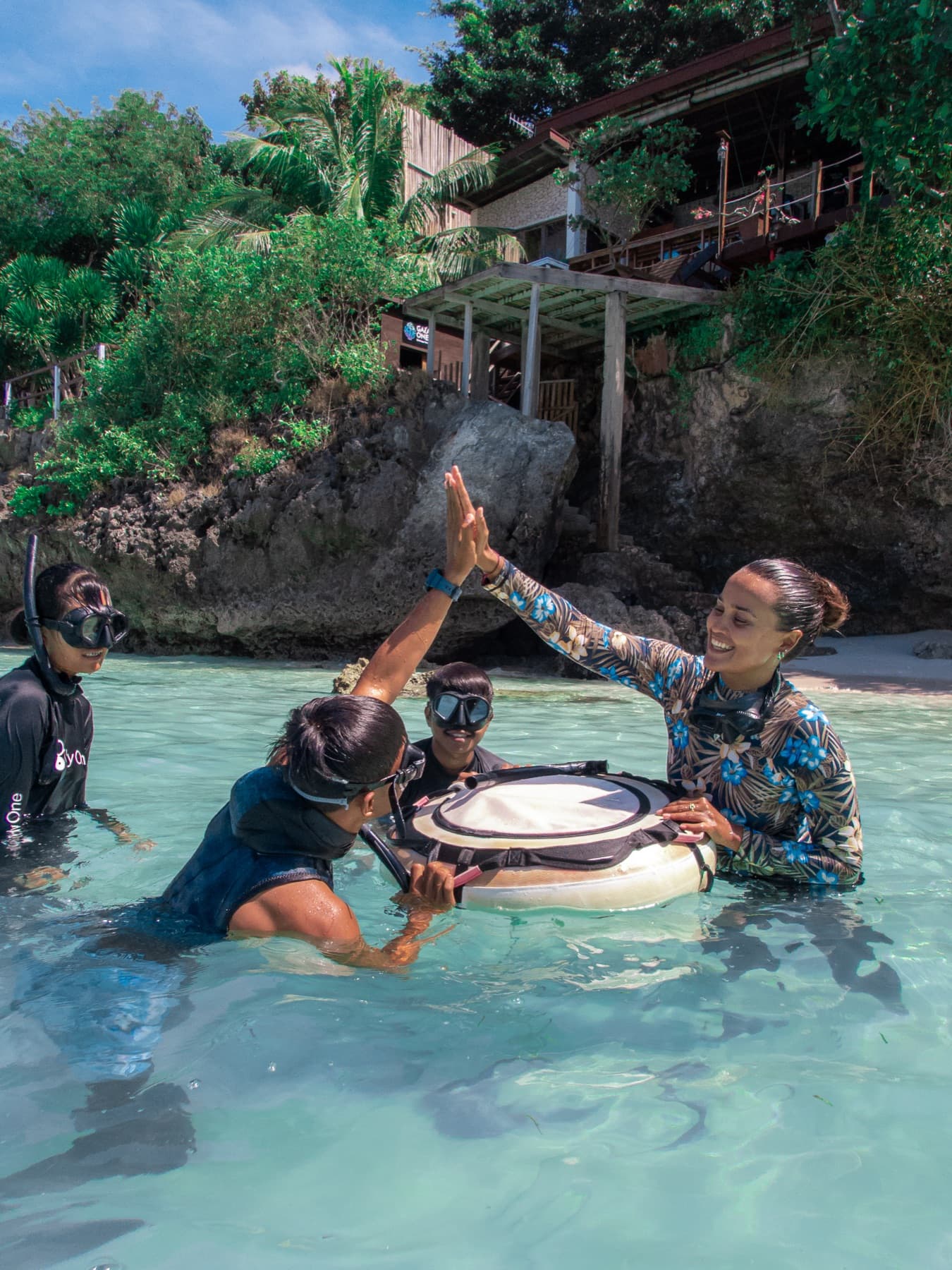Freediver descending a guide line in deep blue water off Bira, South Sulawesi
